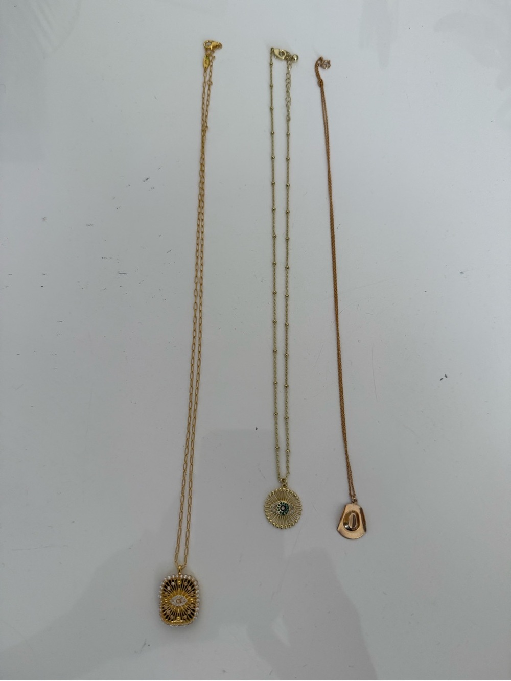 3 gold tone necklaces